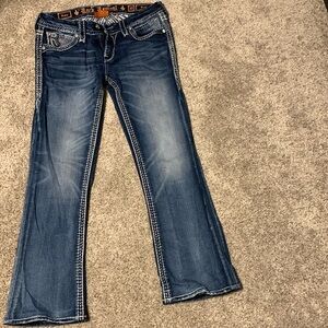 Women’s Rock Revival Jeans waist 30”, inseam 28”.  These jeans have been hemmed